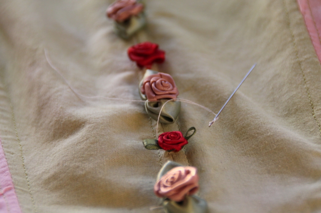 Hand sewing ribbon roses